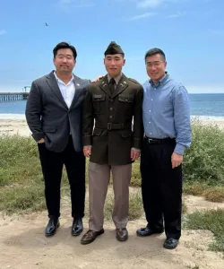 Josh Park with his brother and father at his brother's commissioning ceremony.