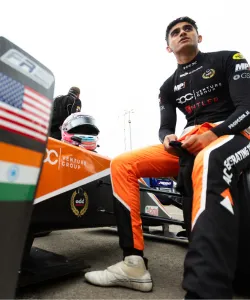Columbia GS incoming student Nikhil Bohra seated next to his racecar