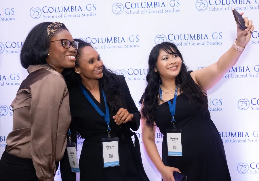 Alumni at Reunion pose for a selfie. 