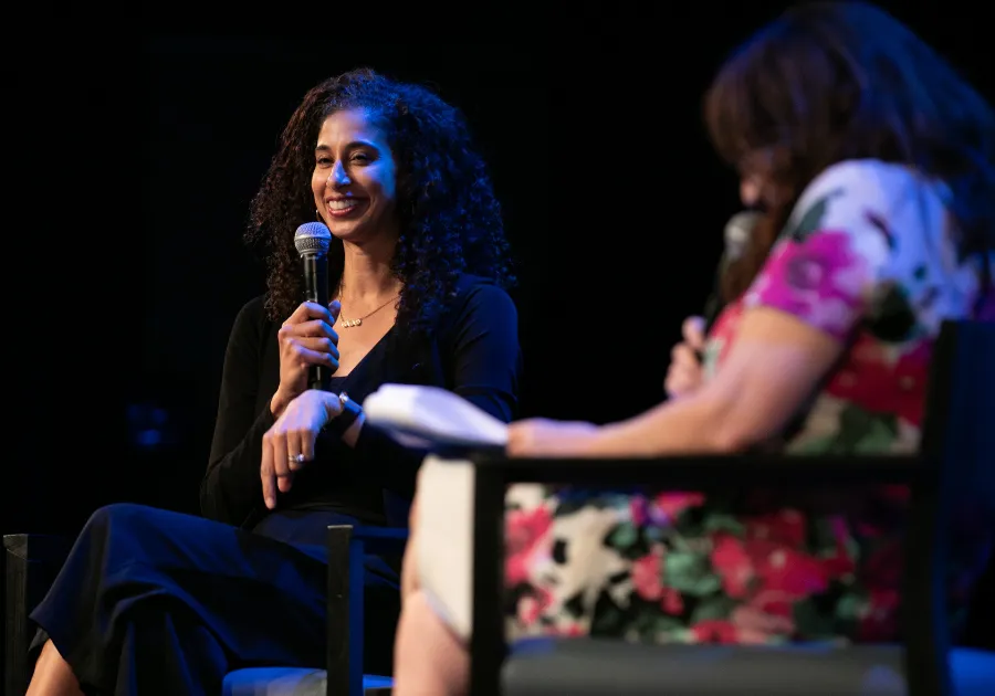 Alumna Alicia Graf Mack '03GS speaking at an event.