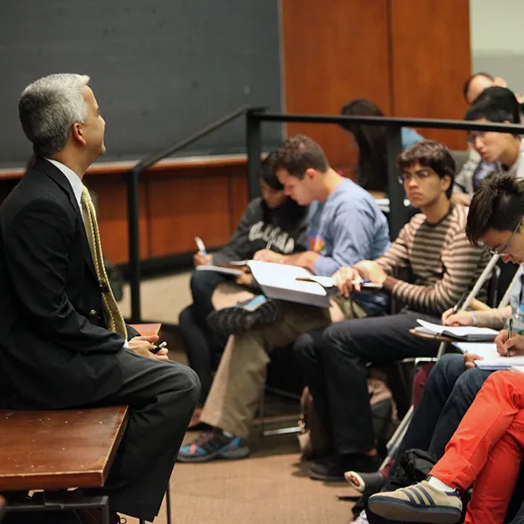 Professor lecturing in a classroom.